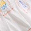 1,5–9 Jahre | Besticktes Set aus ärmellosem Hemd und Shorts 1,5–9 Jahre | Besticktes Set aus ärmellosem Hemd und Shorts