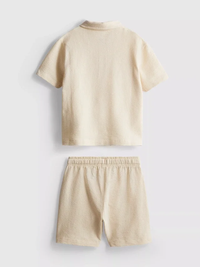 1–9 Jahre | Set aus strukturiertem Poloshirt und Shorts 1–9 Jahre | Set aus strukturiertem Poloshirt und Shorts