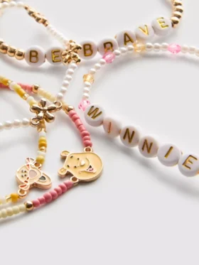 5er-Pack Disney-Perlenarmbänder mit Winnie-Puuh-Anhängern 5er-Pack Disney-Perlenarmbänder mit Winnie-Puuh-Anhängern