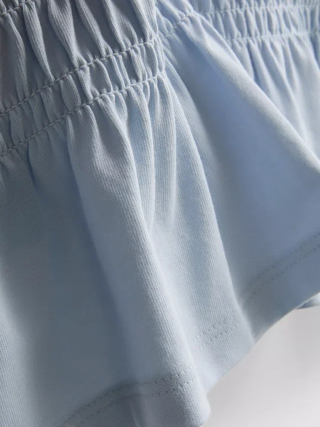 7–15 Jahre | gerafftes Peplum-Hemd 7–15 Jahre | gerafftes Peplum-Hemd