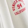 7–15 Jahre | Jogginghose mit grafischem „Venice City“-Print und ausgestellten Beinen 7–15 Jahre | Jogginghose mit grafischem „Venice City“-Print und ausgestellten Beinen