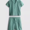 7–15 Jahre | Set aus strukturiertem Kurzarm-Hemd mit Knöpfen und Shorts 7–15 Jahre | Set aus strukturiertem Kurzarm-Hemd mit Knöpfen und Shorts