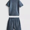 7–15 Jahre | Set aus strukturiertem Kurzarm-Hemd mit Knöpfen und Shorts 7–15 Jahre | Set aus strukturiertem Kurzarm-Hemd mit Knöpfen und Shorts