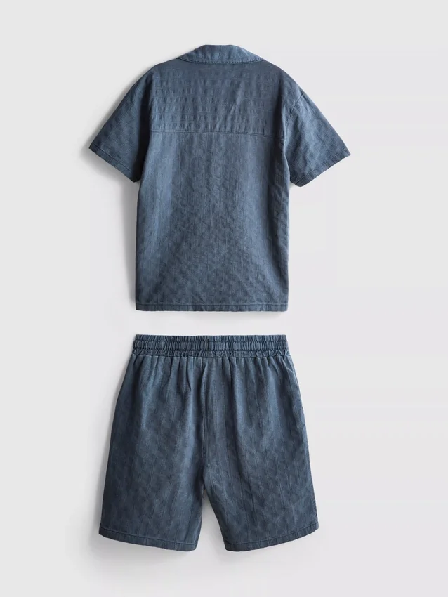 7–15 Jahre | Set aus strukturiertem Kurzarm-Hemd mit Knöpfen und Shorts 7–15 Jahre | Set aus strukturiertem Kurzarm-Hemd mit Knöpfen und Shorts