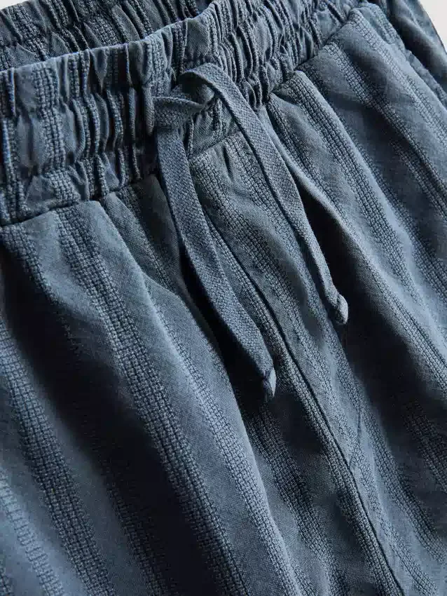 7–15 Jahre | Set aus strukturiertem Kurzarm-Hemd mit Knöpfen und Shorts 7–15 Jahre | Set aus strukturiertem Kurzarm-Hemd mit Knöpfen und Shorts