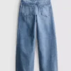 7–15 Jahre | Weite Jeans mit gestickter Blumen-Schleife 7–15 Jahre | Weite Jeans mit gestickter Blumen-Schleife