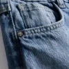7–15 Jahre | Weite Jeans mit gestickter Blumen-Schleife 7–15 Jahre | Weite Jeans mit gestickter Blumen-Schleife