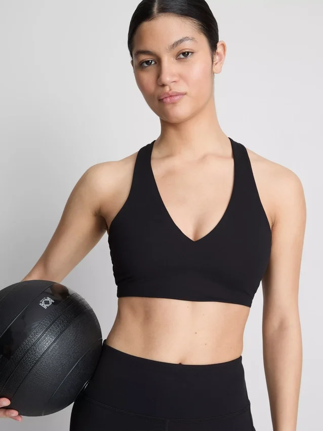 Aktives Crop-Top mit V-Ausschnitt und sanfter Stützfunktion Aktives Crop-Top mit V-Ausschnitt und sanfter Stützfunktion