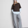 Bauchiges Baumwoll-T-Shirt mit Rundhalsausschnitt Bauchiges Baumwoll-T-Shirt mit Rundhalsausschnitt