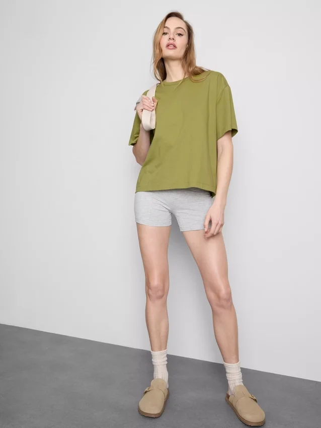 Bauchiges Baumwoll-T-Shirt mit Rundhalsausschnitt Bauchiges Baumwoll-T-Shirt mit Rundhalsausschnitt