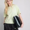 Bauchiges Baumwoll-T-Shirt mit Rundhalsausschnitt Bauchiges Baumwoll-T-Shirt mit Rundhalsausschnitt