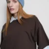 Bauchiges Baumwoll-T-Shirt mit Rundhalsausschnitt Bauchiges Baumwoll-T-Shirt mit Rundhalsausschnitt