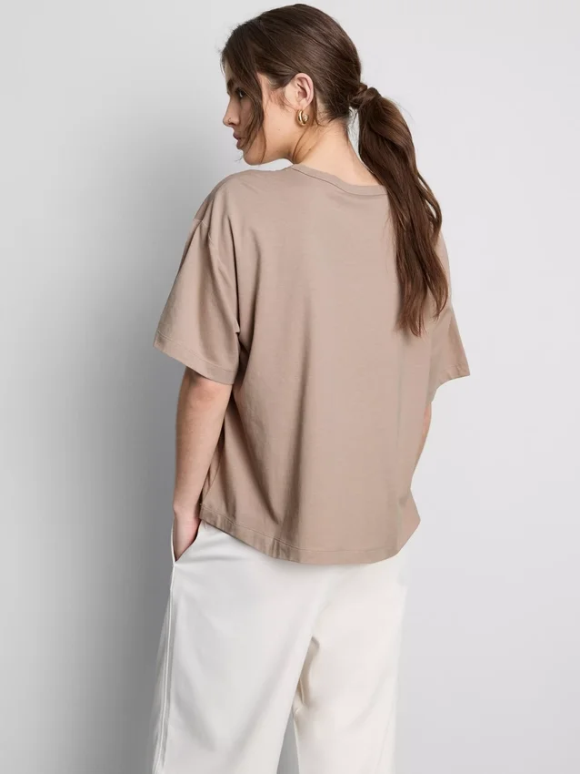 Bauchiges Baumwoll-T-Shirt mit Rundhalsausschnitt Bauchiges Baumwoll-T-Shirt mit Rundhalsausschnitt