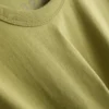 Bauchiges Baumwoll-T-Shirt mit Rundhalsausschnitt Bauchiges Baumwoll-T-Shirt mit Rundhalsausschnitt