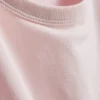 Bauchiges Baumwoll-T-Shirt mit Rundhalsausschnitt Bauchiges Baumwoll-T-Shirt mit Rundhalsausschnitt