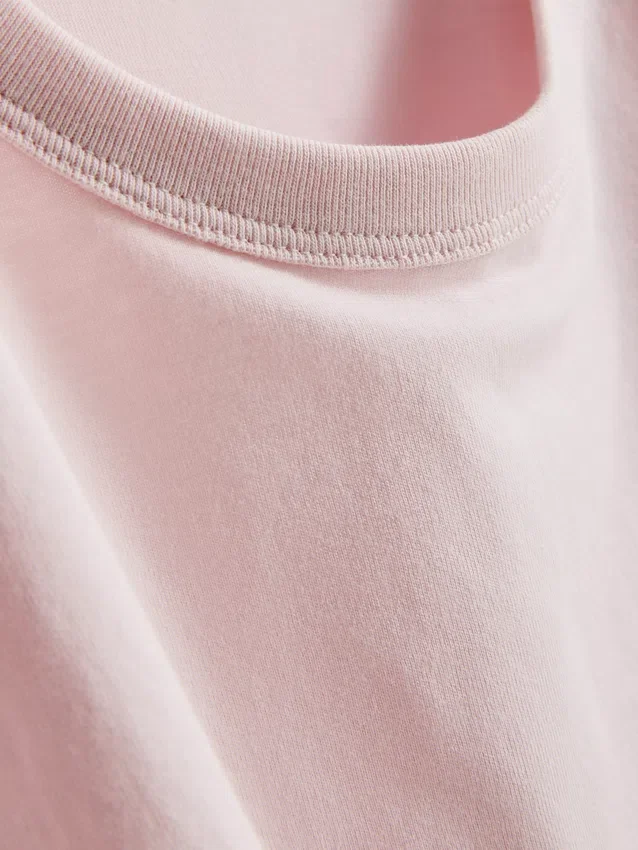 Bauchiges Baumwoll-T-Shirt mit Rundhalsausschnitt Bauchiges Baumwoll-T-Shirt mit Rundhalsausschnitt