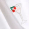 Baumwollreiches, kurzes Baby-T-Shirt mit Perlenverzierung