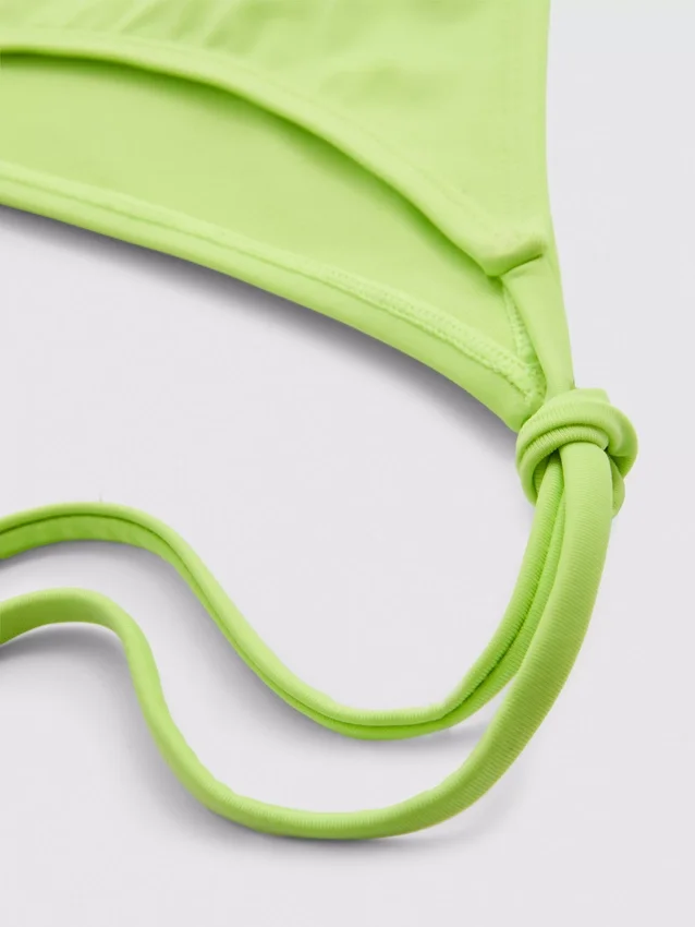 Bikini-Unterteil mit Perlenverzierung und seitlichen Bindebändern Bikini-Unterteil mit Perlenverzierung und seitlichen Bindebändern