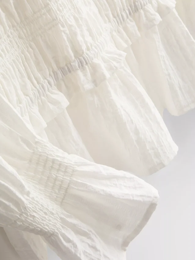Bluse mit gerafftem Peplum-Saum Bluse mit gerafftem Peplum-Saum
