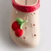 Clogs mit Frucht-Emblem