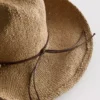 Cowboyhut aus Stroh mit Besatz Cowboyhut aus Stroh mit Besatz