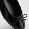 Flache Schuhe mit Lack