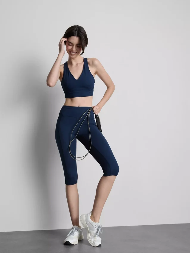 Hoch taillierte, glatte Active-Capri-Leggings mit Stützfunktion Hoch taillierte, glatte Active-Capri-Leggings mit Stützfunktion