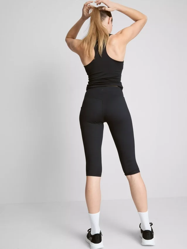 Hoch taillierte, glatte Active-Capri-Leggings mit Stützfunktion Hoch taillierte, glatte Active-Capri-Leggings mit Stützfunktion