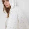 Hoodie mit durchgehendem Reißverschluss aus baumwollreichem Stoff mit Blumenmuster Hoodie mit durchgehendem Reißverschluss aus baumwollreichem Stoff mit Blumenmuster