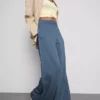 Jogginghose mit weitem Bein und Falten aus baumwollreichem Material Jogginghose mit weitem Bein und Falten aus baumwollreichem Material