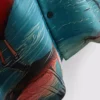 Kurzärmeliges Hemd mit Knöpfen und Flamingo-Print Kurzärmeliges Hemd mit Knöpfen und Flamingo-Print