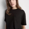 Longline-T-Shirt mit aufgesetzter Tasche Longline-T-Shirt mit aufgesetzter Tasche