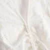 Mini-Kleid aus Baumwolle mit Lochstickerei und Rüschen Mini-Kleid aus Baumwolle mit Lochstickerei und Rüschen