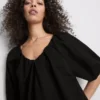 Mini-Smockkleid mit Puffärmeln Mini-Smockkleid mit Puffärmeln