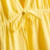 Minikleid aus Baumwolle mit Stufenschnitt und V-Ausschnitt Minikleid aus Baumwolle mit Stufenschnitt und V-Ausschnitt