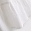 Minikleid aus Baumwolle mit Stufenschnitt und V-Ausschnitt Minikleid aus Baumwolle mit Stufenschnitt und V-Ausschnitt