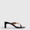 Mules mit Fersenriemen und Tiermuster