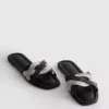 Mules mit geflochtenen Riemen Mules mit geflochtenen Riemen