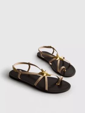 Paula Echevarría Riemchensandalen mit Seestern-Motiv
