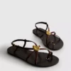 Paula Echevarría Riemchensandalen mit Seestern-Motiv