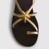 Paula Echevarría Riemchensandalen mit Seestern-Motiv