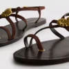 Paula Echevarría Riemchensandalen mit Seestern-Motiv