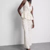 Peplum-Top mit Neckholder und Polka-Dots Peplum-Top mit Neckholder und Polka-Dots