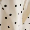 Peplum-Top mit Neckholder und Polka-Dots Peplum-Top mit Neckholder und Polka-Dots