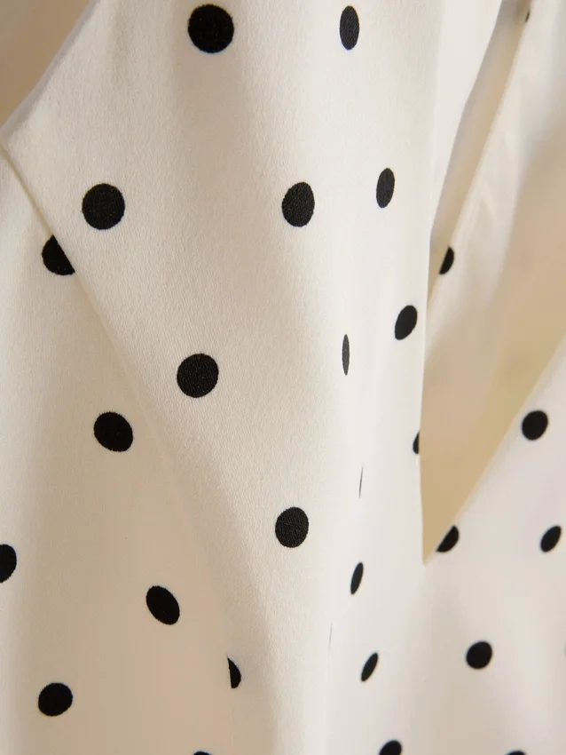 Peplum-Top mit Neckholder und Polka-Dots Peplum-Top mit Neckholder und Polka-Dots