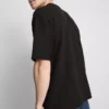 Strukturiertes, kastenförmiges T-Shirt Strukturiertes, kastenförmiges T-Shirt