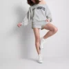 The Primark Scene | Sweatshirt mit Slogan und schulterfreiem Ausschnitt The Primark Scene | Sweatshirt mit Slogan und schulterfreiem Ausschnitt