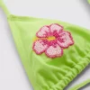 Triangel-Bikini-Oberteil mit Perlenblume Triangel-Bikini-Oberteil mit Perlenblume
