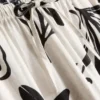 Weit geschnittene Hose mit Aufdruck Weit geschnittene Hose mit Aufdruck